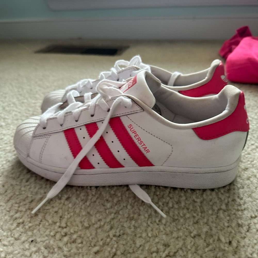 Pink and white adidas